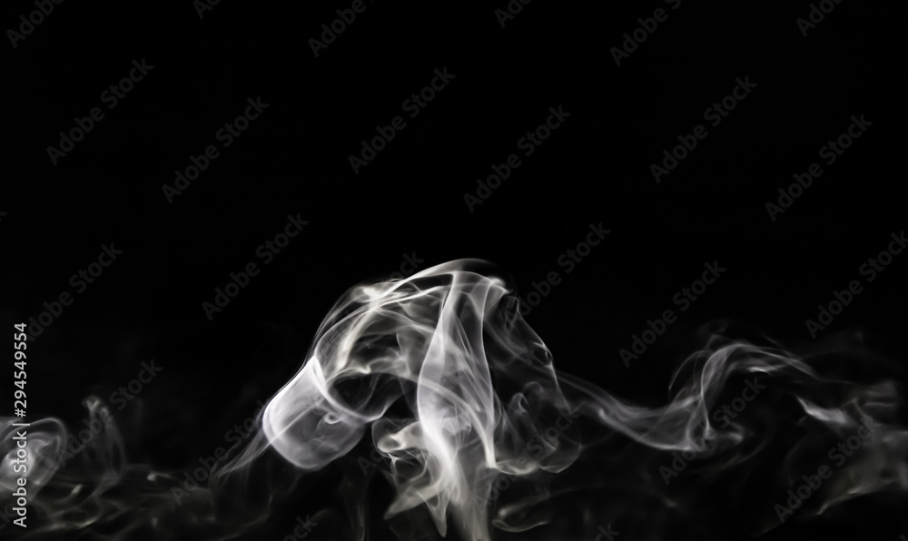 Fototapeta premium Smoke trail from candles lit from the side