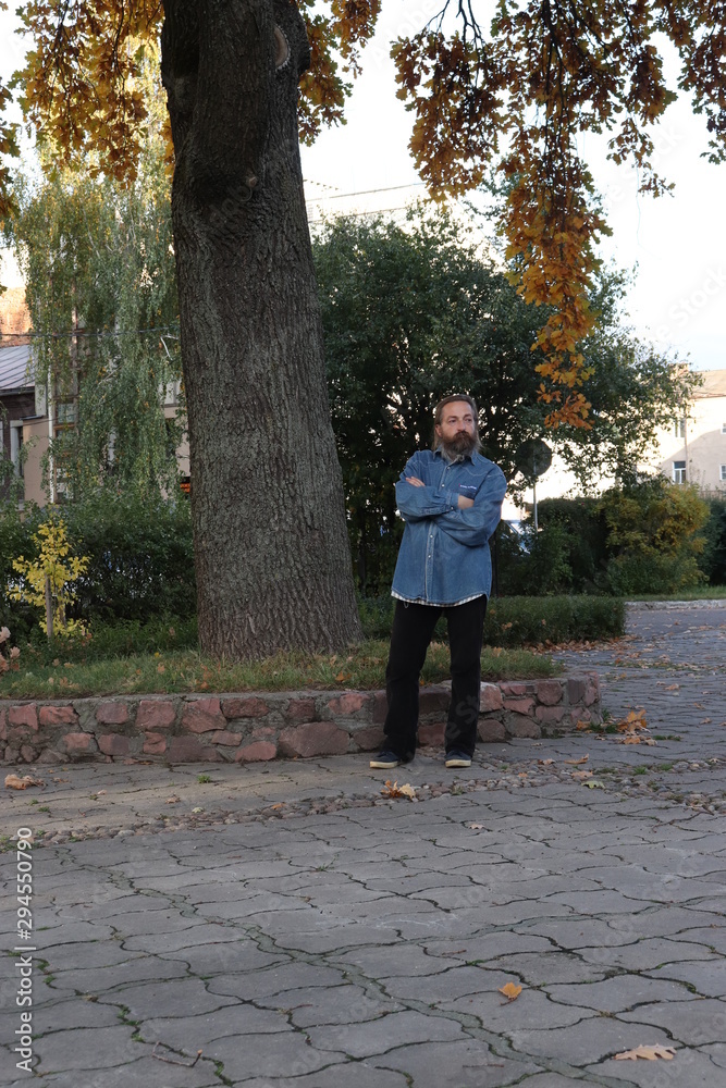 Fototapeta premium young man walking in the park