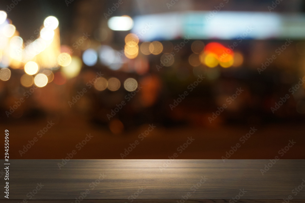 Empty dark wooden table in front of abstract blurred bokeh background of restaurant . can be used for display or montage your products.Mock up for space. Empty dark wooden table in front of abstract blurred bokeh background of restaurant . can be used for display or montage your products.Mock up for space.