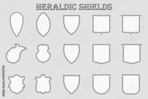 Set of 15 heraldic monochrome shields in a frame. Knightly medieval signs in the form of silhouette.