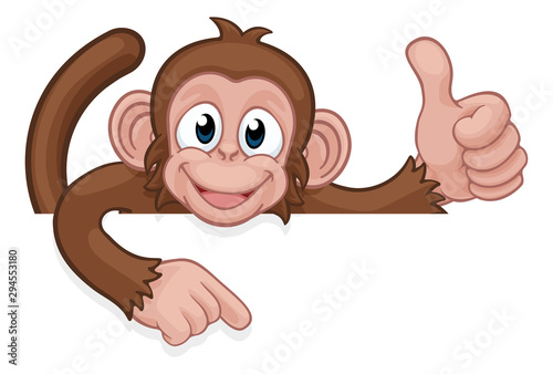Canvas Print A monkey cartoon character animal peeking over a sign and pointing at it while d