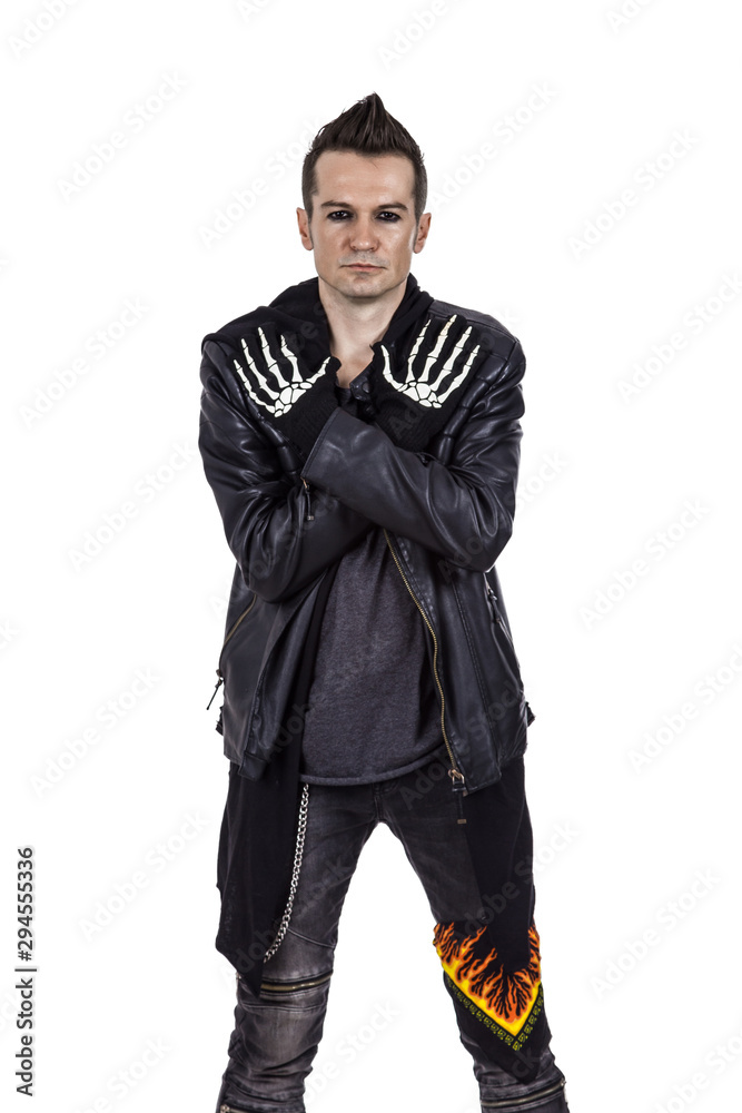 Portrait of hard rock performer with crossed arms. Portrait of hard rock performer with crossed arms.
