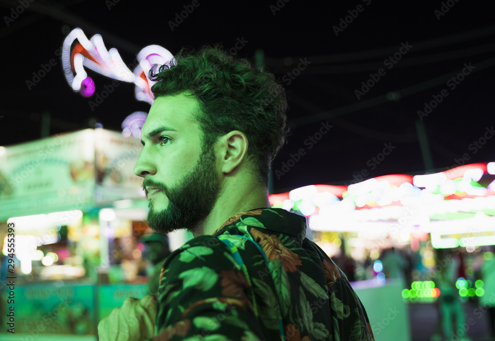 Fototapeta premium Man at funfair looking away