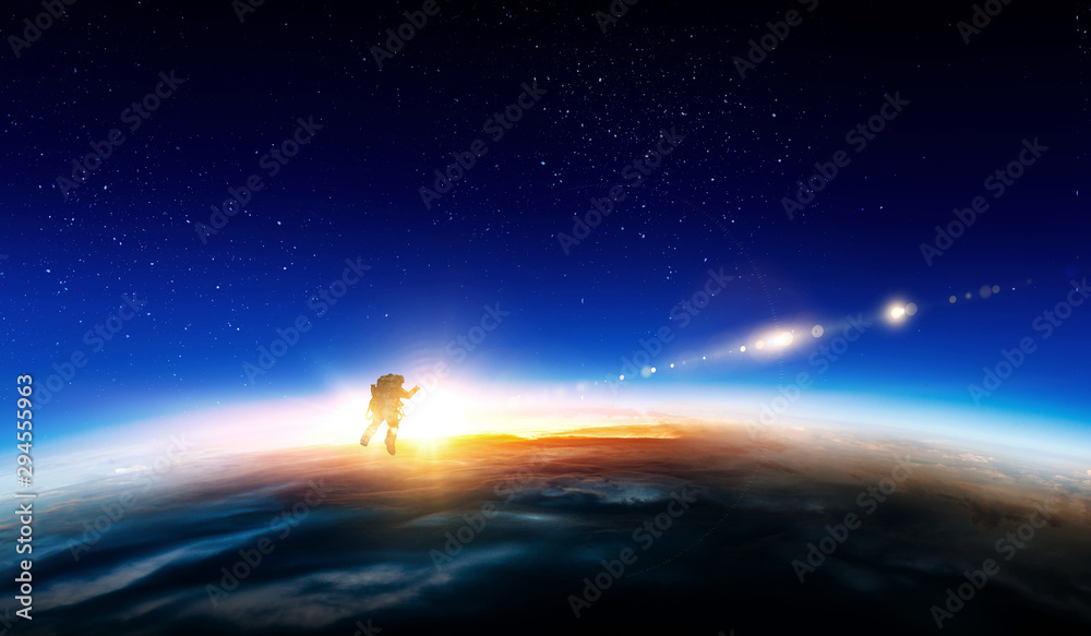 Fototapeta premium Spaceman and planet, human in space concept