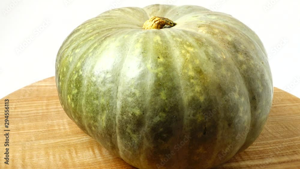 Pumpkin on a kitchen board. Shooting in the movement. Pumpkin on a kitchen board. Shooting in the movement.