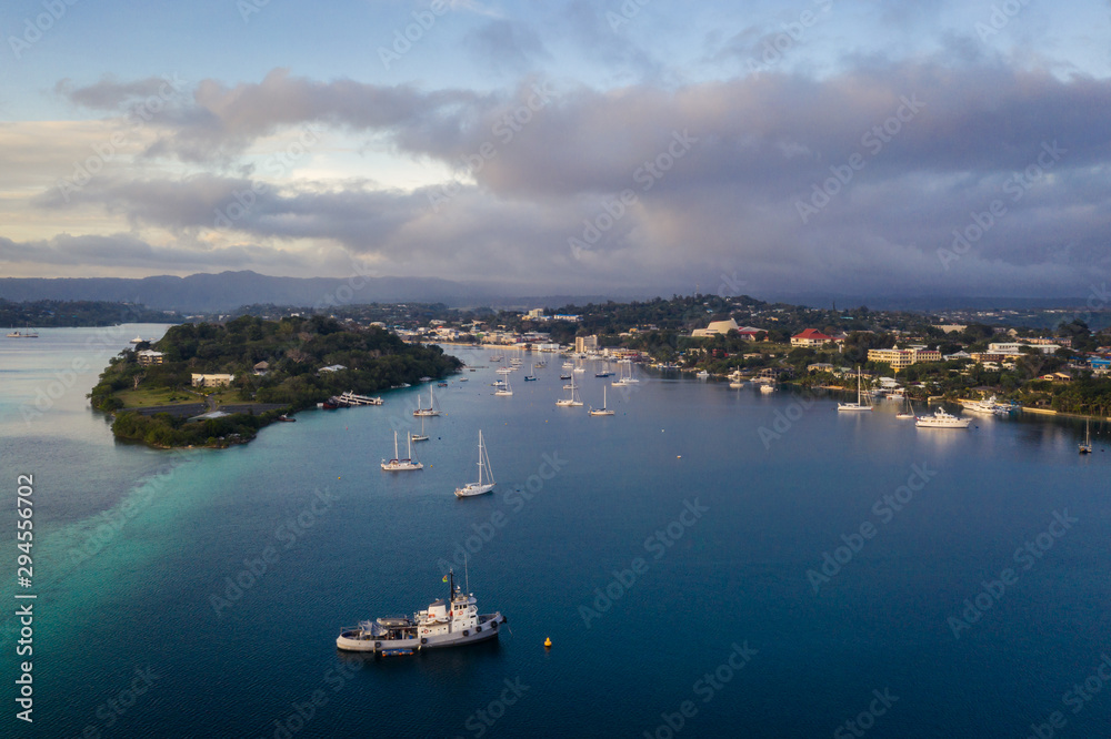 Nightfall over the Port Vila harbor with sailboat and other yachts in Vanuatu capital city