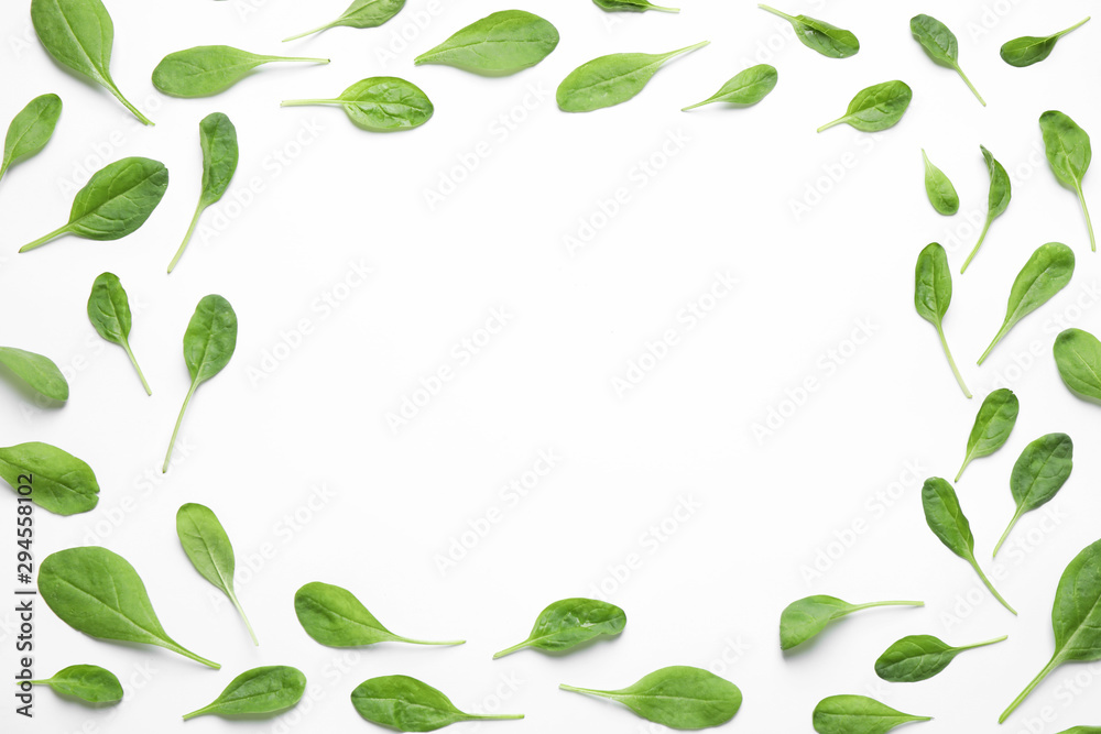 Frame of fresh green healthy spinach on white background, top view. Space for text Frame of fresh green healthy spinach on white background, top view. Space for text