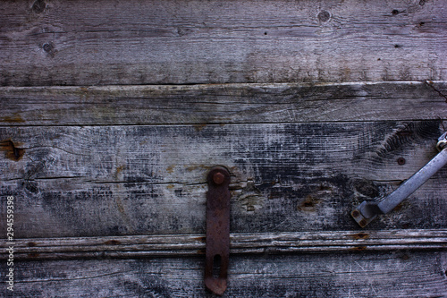 Blue faded painted wooden texture, background, wallpaper. Wooden background, painted surface blue boards. Antique texture for design. Weathered black  wooden background texture.