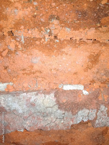 Background with destroyed brick wall close up