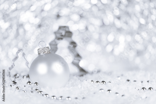 Fir tree cutter  bauble and pearls in white and silver  snowflakes in the front