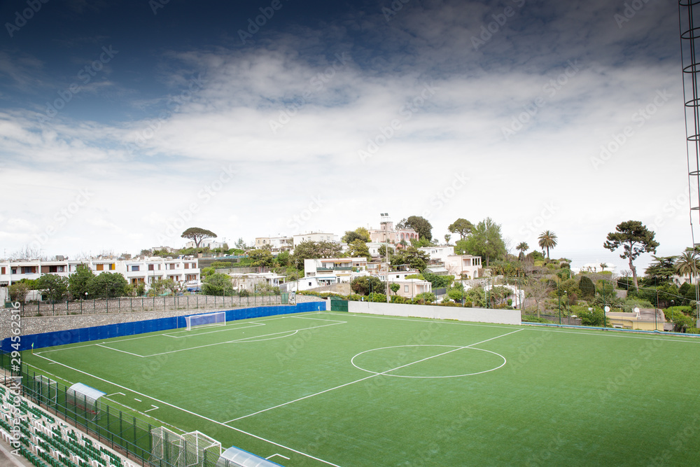 large football pitch in the city of capri italy - obrazy, fototapety, plakaty 