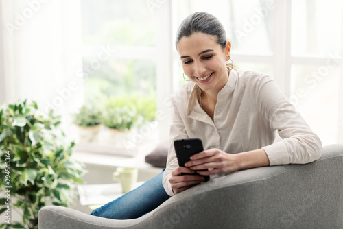 Happy woman connecting with her smartphone Free Download Happy woman connecting with her smartphone - GFXLoad