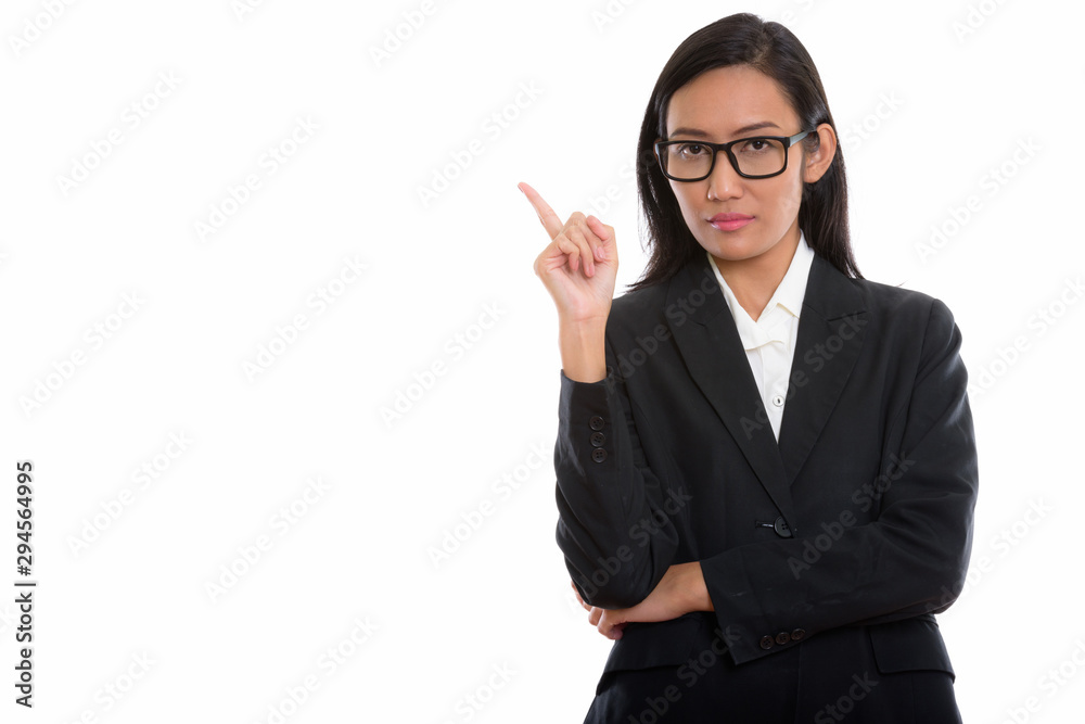 Studio shot of young beautiful Asian businesswoman Studio shot of young beautiful Asian businesswoman