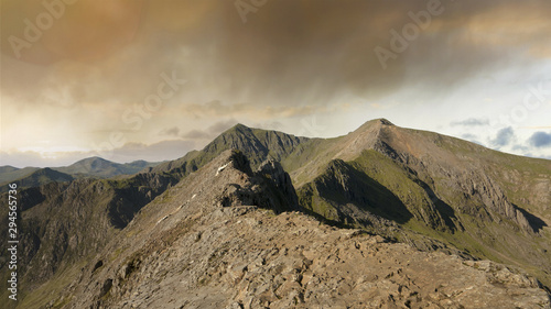 Crib Goch ridge in Snowdonia, Wales, UK with gorgeous dusk clouds