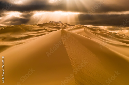 Sunset over the sand dunes in the desert