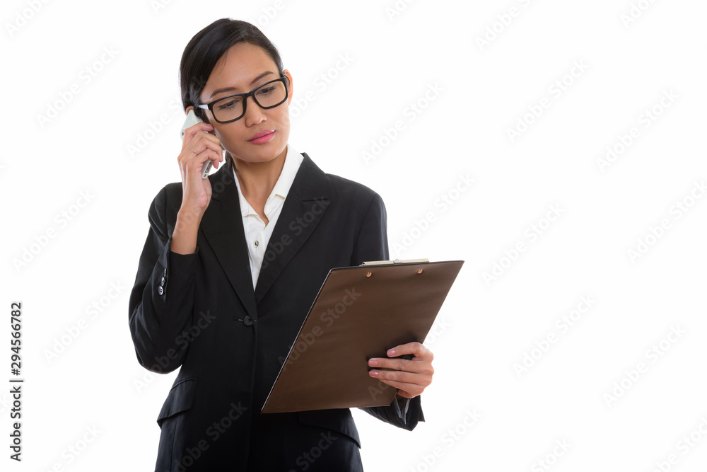 Studio shot of young beautiful Asian businesswoman Studio shot of young beautiful Asian businesswoman
