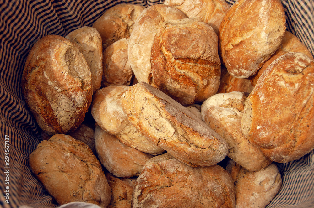 Fresh baked artisanal rustic bread close-up, top view. Traditional Spanish artisanal bread, with onion.