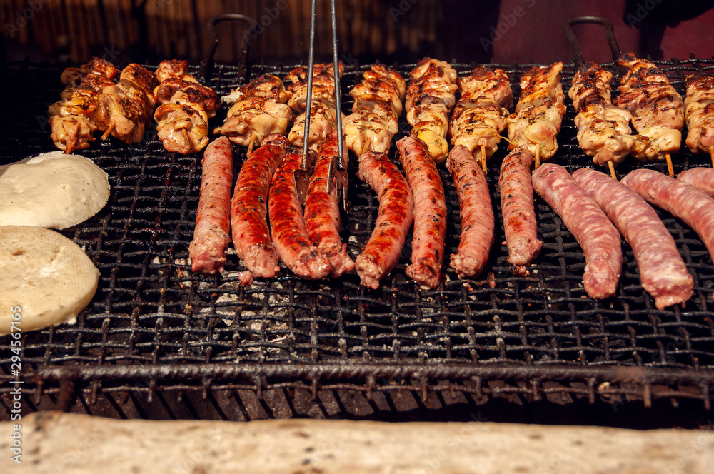 Close up barbecue grill. Assorted delicious grilled meat.