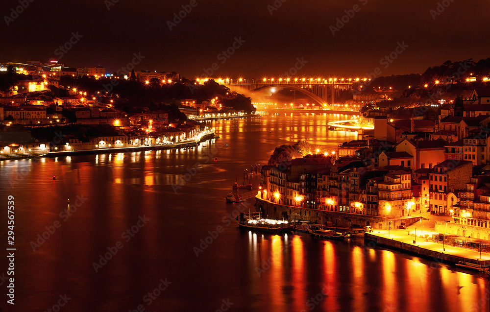 Porto, Portugal  old town ribeira with night light, Douro river. Night view aerial perspective landmark.
