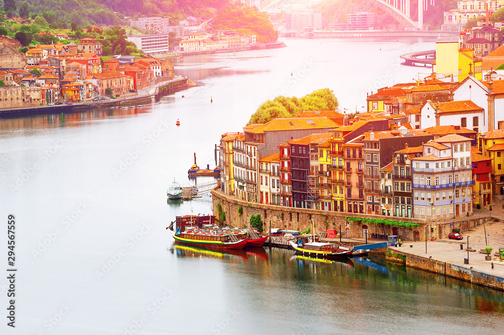 Porto, Portugal suny old town ribeira with colorful houses, Douro river. Sunset aerial perspective landmark.