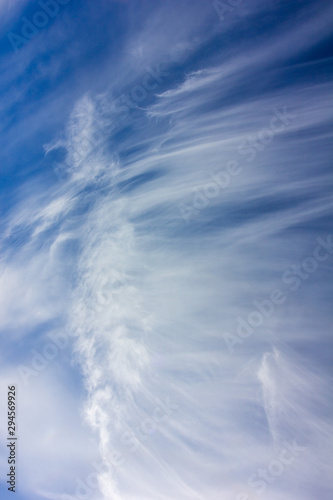 picturesque blue sky with white Cirrus clouds on an autumn day