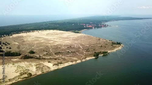 Aerial, reverse, drone shot overlooking the Parnidis dune, Parnidzio kopa, on a cloudy day, at Nida, in Lithuania photo