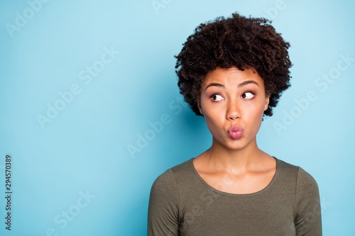 Portrait of negative anxious dark skin girl with lips pouted plump look stare made mistake worry wear style clothes isolated over blue color background