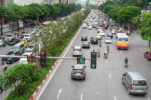 Traffic light with street traffic on background in Hanoi street