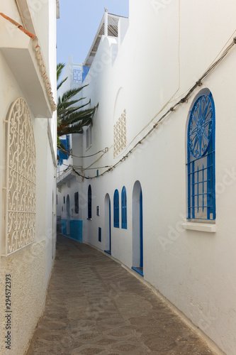 Narrow old street  in the medina of Assilah photo