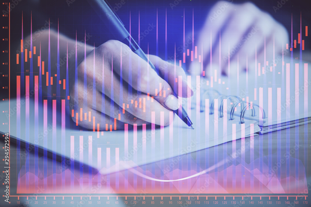 Forex graph on hand taking notes background. Concept of research. Multi exposure Forex graph on hand taking notes background. Concept of research. Multi exposure