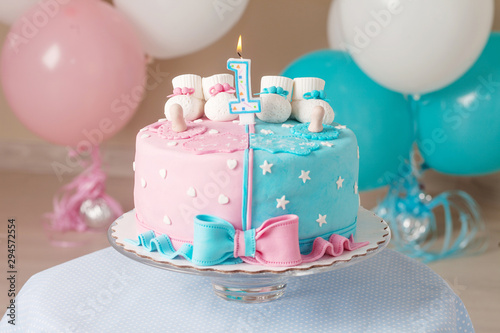 Photography Colorful decoration of a first year birthday cake for twins