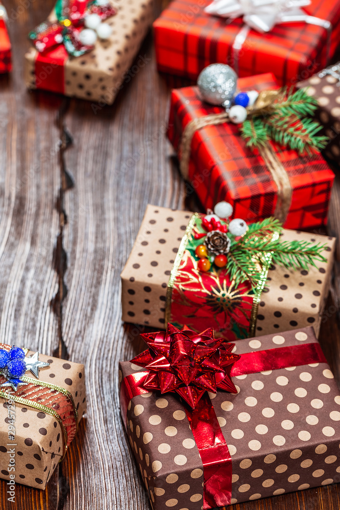 Christmas gifts with christmas decoration on wooden background closeup