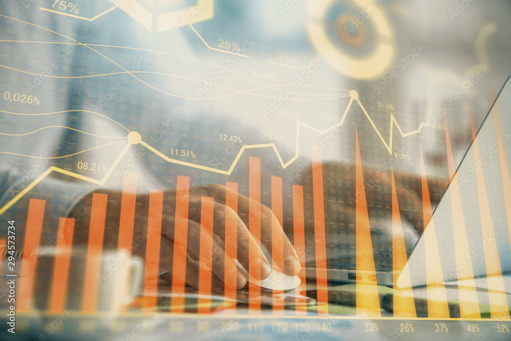 Double exposure of forex graph with man working on computer on background. Concept of market analysis. Double exposure of forex graph with man working on computer on background. Concept of market analysis.