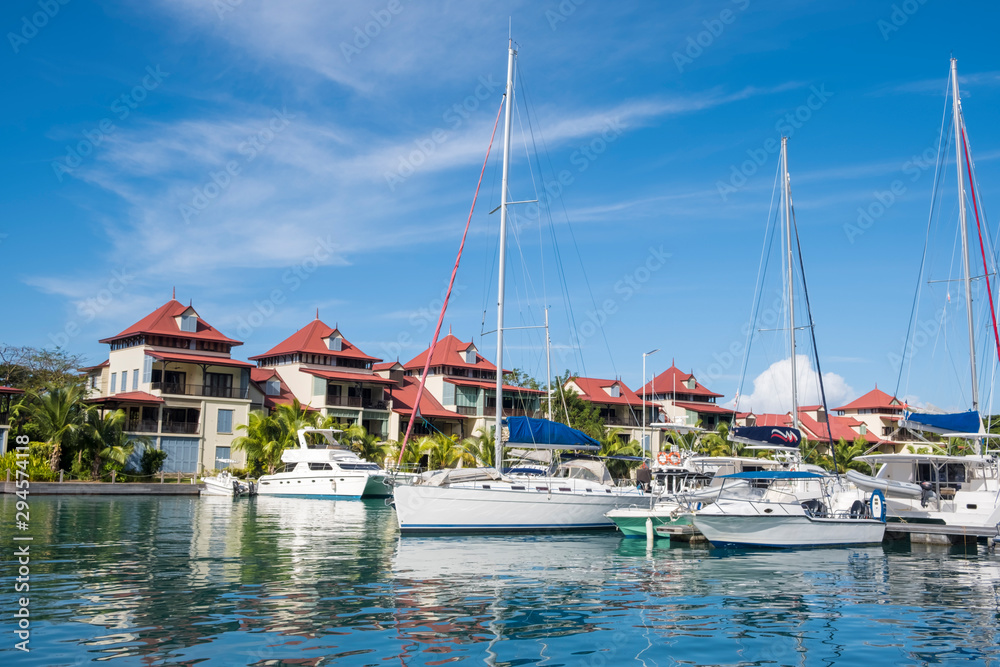 Luxury yachts and Boats  in sunny summer day at marina of Eden Island, Mahe, Seychelles