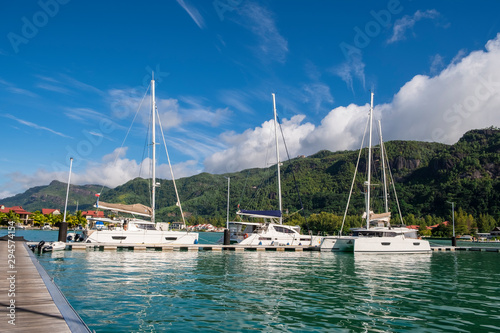 Luxury yachts and Boats in sunny summer day at marina of Eden Island, Mahe, Seychelles