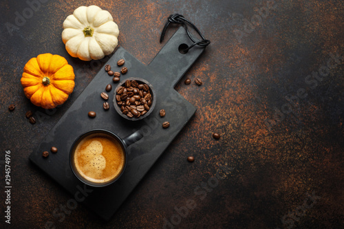 Autumn arrangement with coffee and pumpkin