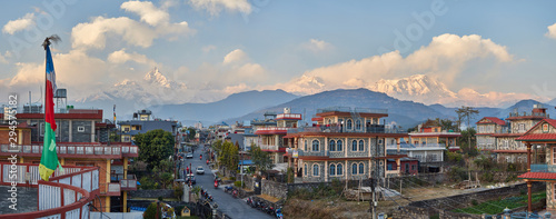 Panorama of sunset Pokhara in the Rambazar district, on the background of the Himalayan ridge with the majestic Machapuchare, which is part of the Annapurna massif. Nepal photo