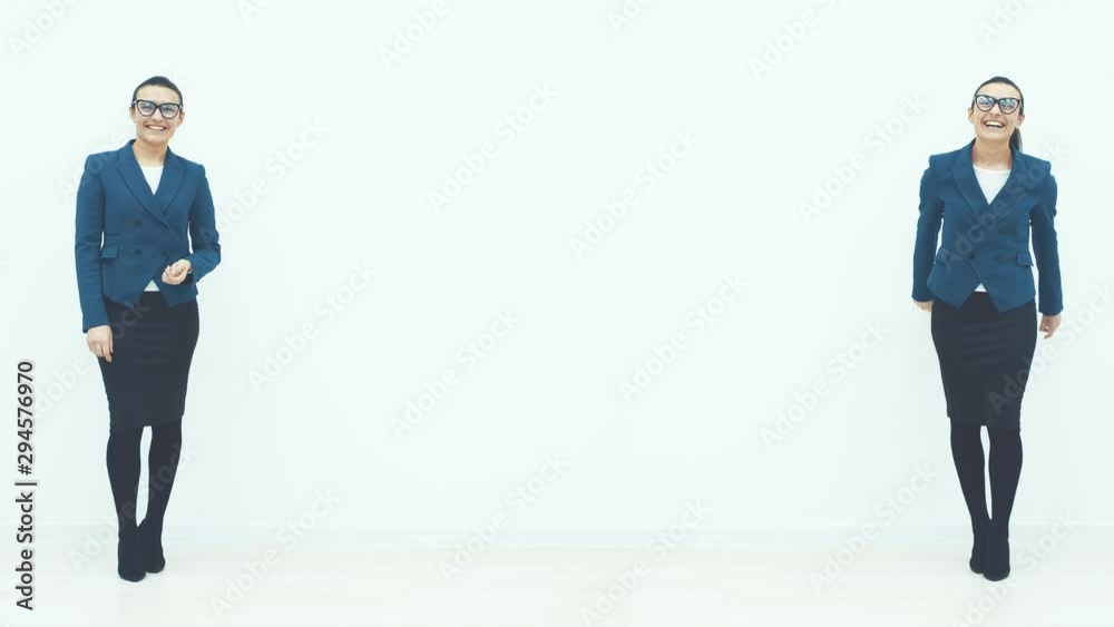 Two sisters of a business lady standing on a white background smiling. Dressed in business clothes. Smile Two sisters of a business lady standing on a white background smiling. Dressed in business clothes. Smile