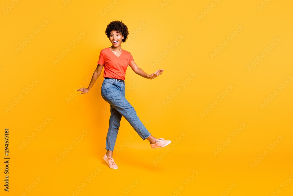 Copyspace photo of cheerful charming cute attractive curly wavy sweet pretty girlfriend rejoicing with sales isolated over yellow vivid color background Copyspace photo of cheerful charming cute attractive curly wavy sweet pretty girlfriend rejoicing with sales isolated over yellow vivid color background