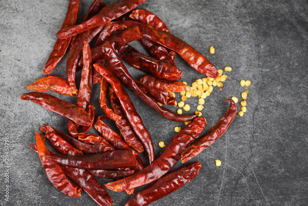 Red chili pepper seed / dried chillies on dark background