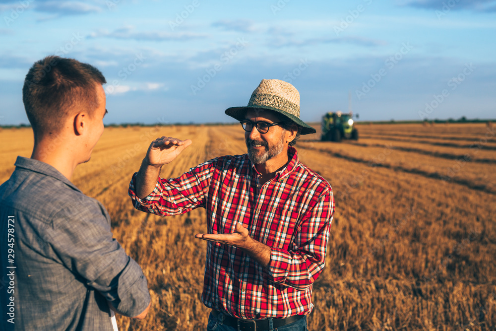 © cherryandbees - two ranchers talking outdoor on wheat field © cherryandbees - two ranchers talking outdoor on wheat field