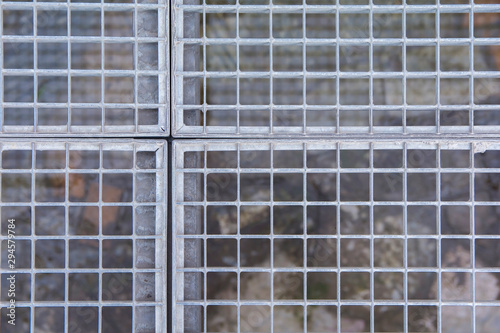 Wallpaper Mural silver metal grill restricts access to the protected object Torontodigital.ca