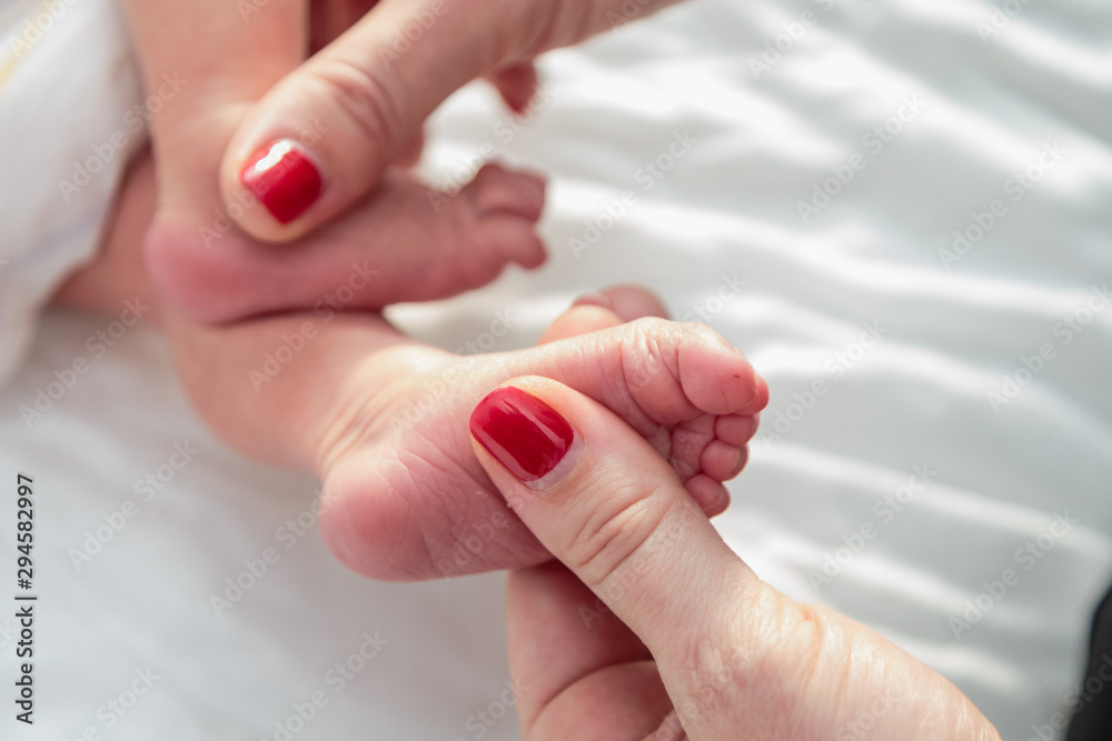 Newborns. Children's legs in the palm of your hand. Close-up. Newborns. Children's legs in the palm of your hand. Close-up.