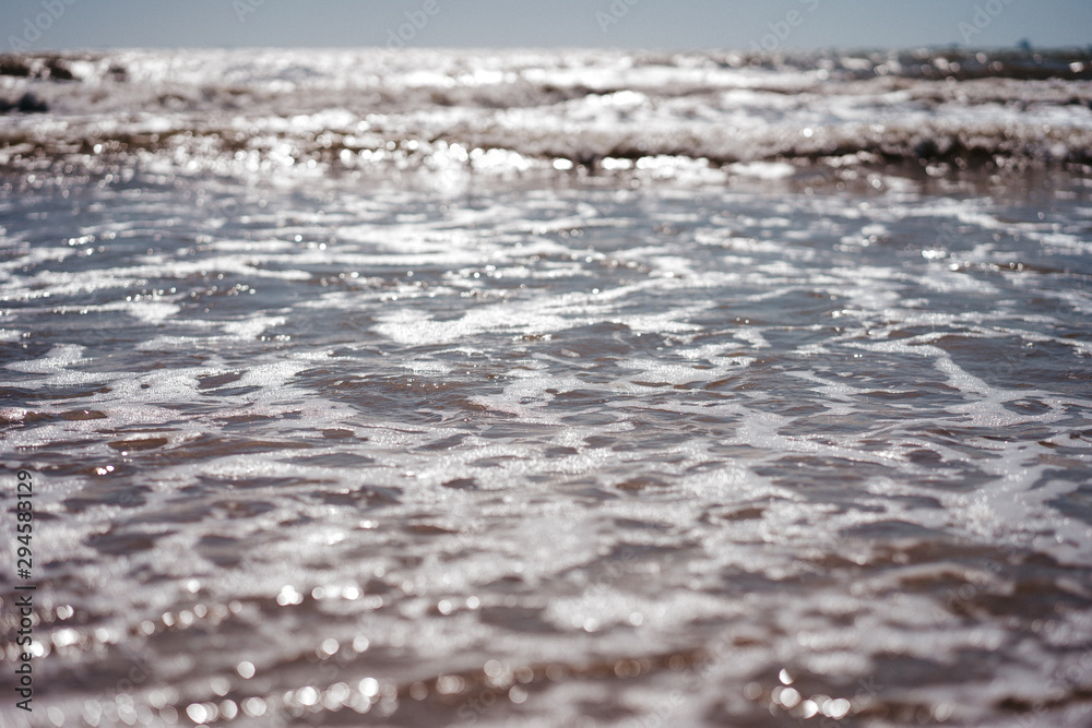 sea view from the shore, small waves sea view from the shore, small waves