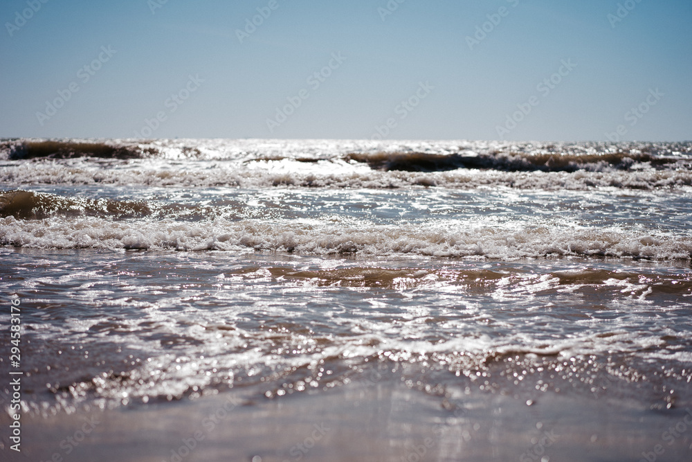 sea view from the shore, small waves sea view from the shore, small waves