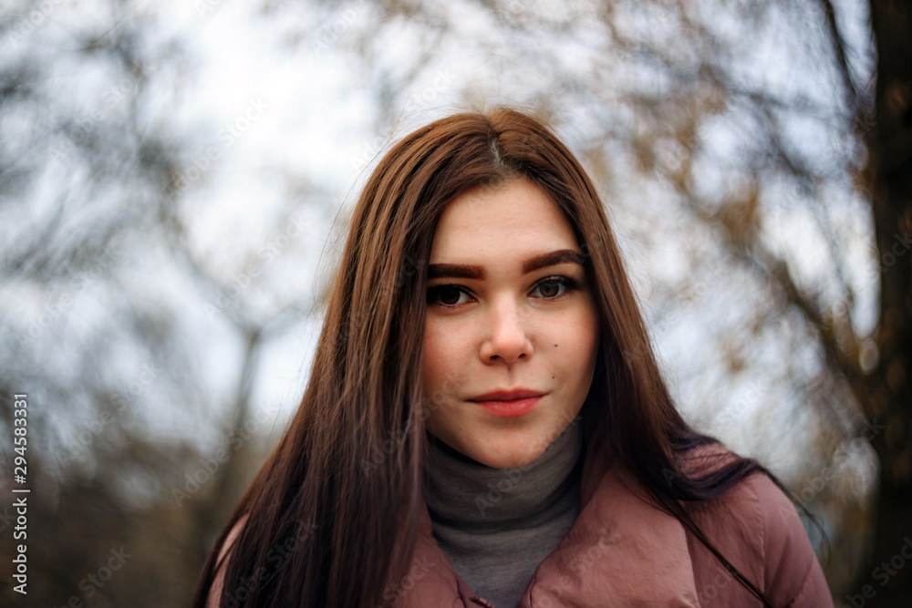 Portrait of a beautiful plus size brunette with a blurred background. Portrait of a beautiful plus size brunette with a blurred background.