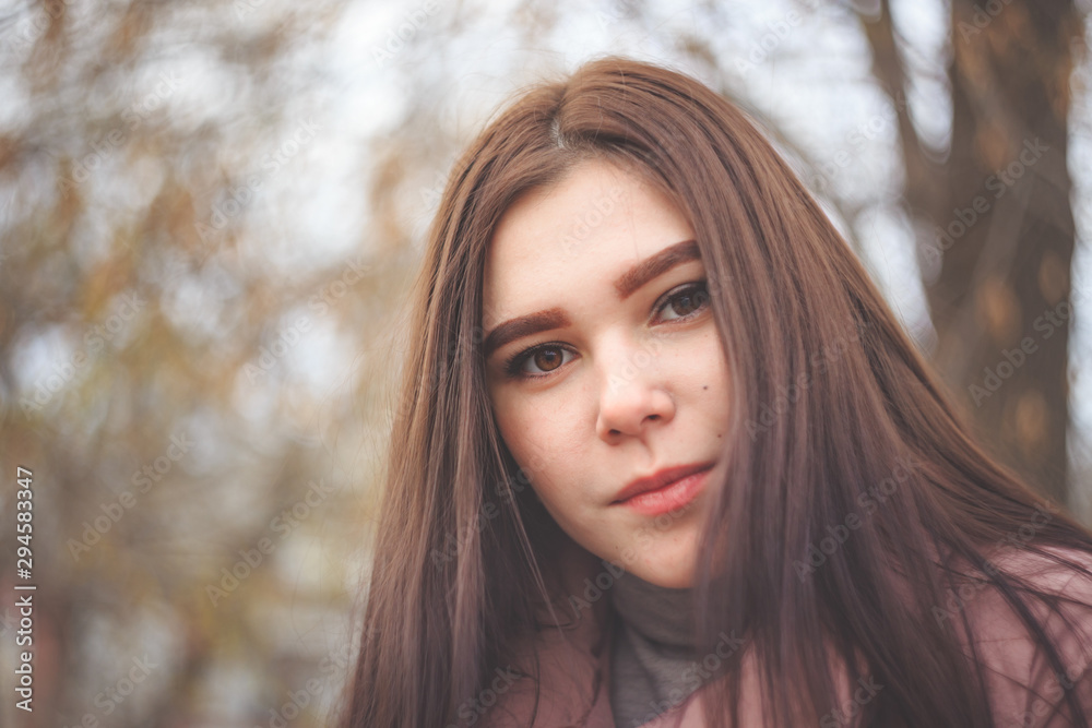 Portrait of a beautiful plus size brunette with a blurred background. Portrait of a beautiful plus size brunette with a blurred background.