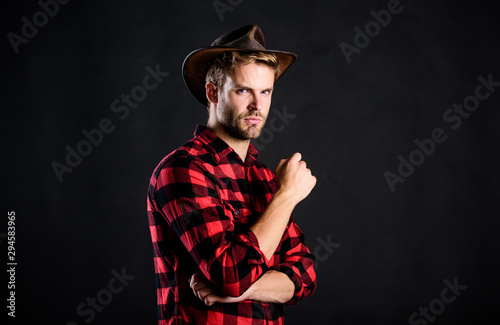 brave cowboy. Vintage style man. Wild West retro cowboy. cowboy in country side. Western. man checkered shirt on ranch. western cowboy portrait. wild west rodeo. Handsome man in hat