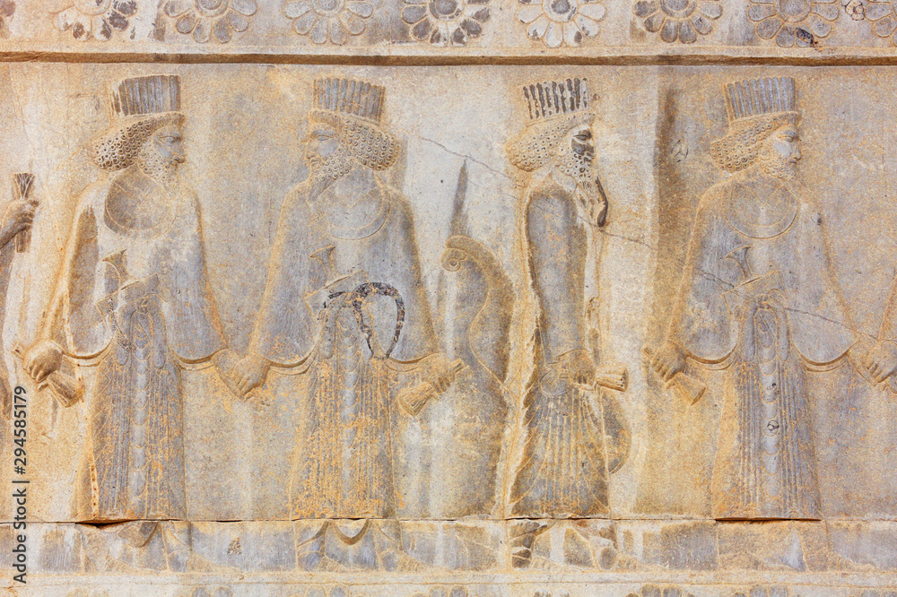 Image of ancient Persian ambassadors. An ancient relief on the walls of the ruined city of Persepolis. Persepolis. Iran.