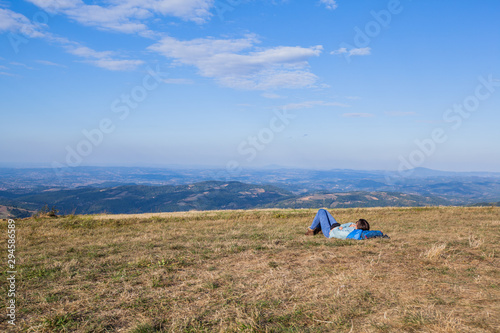 Hiker woman relaxing after walking